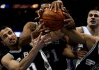 Manu Ginobili, left, and a host of San Antonio Spurs go for a rebound as Denver Nuggets, Linas Kleiza, right, looks on at the Pepsi Center in downtown Denver, Colo.  Photo by Matt McClain