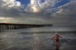 Guy Cooper, 74, of Ventura, Calif. climbs out of the water after swimming around the Ventura pier as the sun rises. Cooper along with a handful of others make the swim each morning.  Photo by Matt McClain