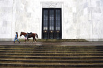 A demonstrator walks with a horse as she prepares to take part in a rally outside the Oregon State Capitol to honor LaVoy Finicum, who was killed by law enforcement officers and the men who were arrested in connection to the occupation of the Malheur National Wildlife Refuge on Saturday March 05, 2016 in Salem, OR. (Photo by Matt McClain/ The Washington Post)