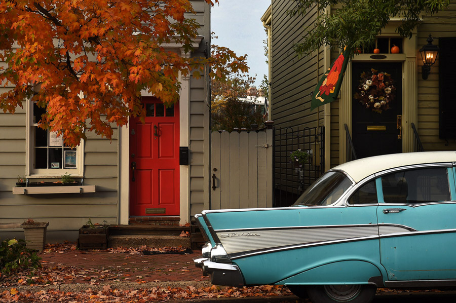 A vintage Chevrolet Bel Air is parked in front of fall foliage and decorations along Prince Street on Saturday October 31, 2015 in Alexandria, VA. (Photo by Matt McClain/ The Washington Post)