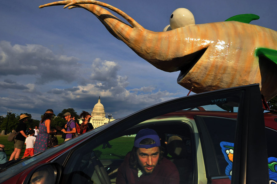 Mason McMonegal gets out of one of a fleet of vehicles that will be part of the Are We Eating Fishy Food Tour during an event to promote the trip near the U.S. Capitol on Monday August 05, 2013 in Washington, DC.  The tour, which will conclude in Seattle, WA is promoting the labeling of food that is genetically engineered.  (Photo by Matt McClain/ The Washington Post)