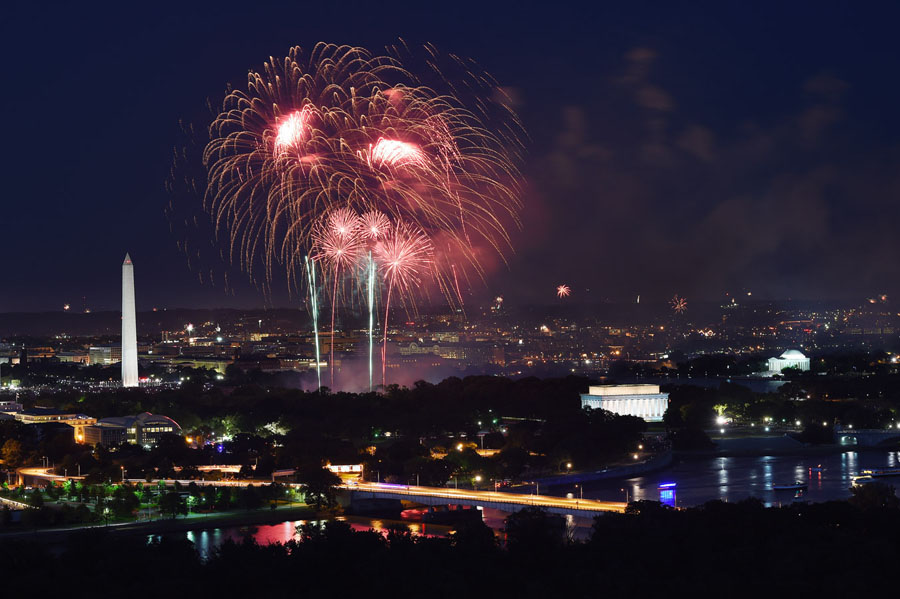 Fourth of July fireworks over Washington, DC are seen from the roof of Waterview Condominium on Friday July 04, 2014 in the Rosslyn area of Arlington, VA.  (Photo by Matt McClain/ The Washington Post)