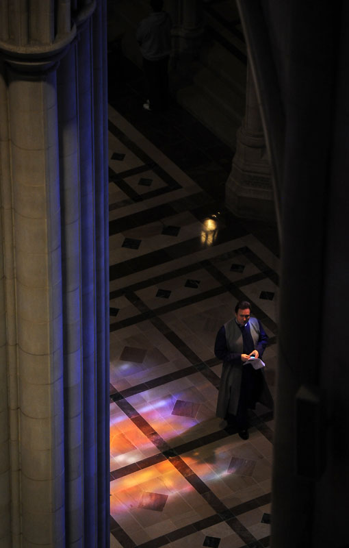 A clergy member is seen from a balcony view during The Sunday of the Passion: Palm Sunday service at Washington National Cathedral on Sunday April 17, 2011 in Washington, DC.  Palm Sunday begins Holy Week which concludes on Easter Sunday.   (Photo by Matt McClain/For The Washington Post)