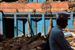 A man walks an earthquake damaged building on Sunday May 03, 2015 in Devighat, Nepal which is located in the Nuwakot District. A deadly earthquake in Nepal has killed thousands. (Photo by Matt McClain/ The Washington Post)