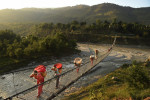 People cross a bridge on Sunday May 03, 2015 in the Nuwakot District of Nepal. A deadly earthquake in Nepal has killed thousands. (Photo by Matt McClain/ The Washington Post)