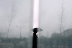 An umbrella clad pedestrian is framed between panels as he walks by the American Veterans Disabled for Life Memorial as it lightly snows on Monday January 26, 2015 in Washington, DC. (Photo by Matt McClain/ The Washington Post)