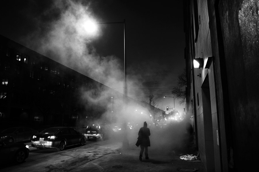 A man is engulfed in steam along D St. NW on a cold Wednesday January 29, 2014 in Washington, DC.  (Photo by Matt McClain/ The Washington Post)    
