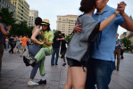 Sylvia Christie, left, and Dong Kim, left center, take part in tango dancing at Freedom Plaza on Sunday June 07, 2015 in Washington, DC. (Photo by Matt McClain/ The Washington Post)