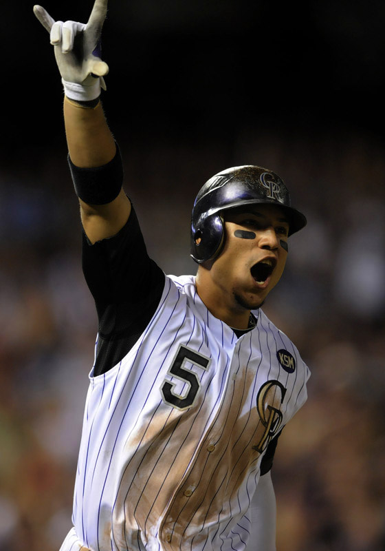 Colorado Rockies' Carlos Gonzalez celebrates a walk-off home run against the Chicago Cubs in the ninth inning of a baseball game at Coors Field in Denver, Colo. on Saturday, July 31, 2010.  (AP Photo/ Matt McClain)