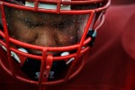 Rain is seen on the face shield of Arvada's Donovan Jimenez on the sidelines during a game against Holy Family on Friday 10/22/10 at the North Area Athletic Center in Golden, Colo.  Photo by Matt McClain