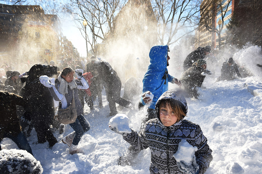 Linden Tarrant, 9, takes part in a large snowball fight in Dupont Circle on Sunday January 24, 2016 in Washington, DC. The Washington, DC area was blanketed by a large snow event. (Photo by Matt McClain/ The Washington Post)