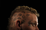 Tattooed stars and spots decorate the head of Sean {quote}Halo{quote} Jankowski, 27, of Brooklyn, MD as he poses for a portrait while taking part in the 2011 DC Tattoo Arts Expo at the Doubletree Hotel Washington DC- Crystal City in Arlington, VA on January 14, 2011.  Jankowski sees his tattoos as accessories on his body.  The event concludes Sunday and includes over 100 tattoo artists. 