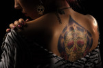 Kaitlyn Cooper, 25, of Baltimore, MD poses for a portrait while taking part in the 2011 DC Tattoo Arts Expo at the Doubletree Hotel Washington DC- Crystal City in Arlington, VA on January 14, 2011.  The tattoo was inspired from the sugar skulls that are associated with the Day of the Dead.  The event concludes Sunday and includes over 100 tattoo artists.  (Photo by Matt McClain/The Washington Post)