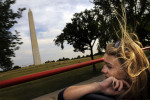 Katrina Berchtold of Bakersfield, CA rides on a double-decker bus while on a tour from Open Top Sightseeing on Wednesday June 15, 2011 in Washington, DC.  Patrons are able to get off the bus on stops and then catch another bus to continue their tour.  (Photo by Matt McClain/For The Washington Post)