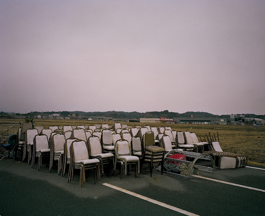 Abandoned chairs from a celebration hall sit in an empty parking lot in the town of Odaka town, Minamisoma, about 8 miles north from the Daiichi nuclear power plant. Mar. 2014