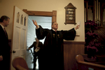 Rev. John, enters the Presbyterian Church to begin a service of reberence and celebration for Edward Frampton in Summerville, SC, Dec. 21, 2014