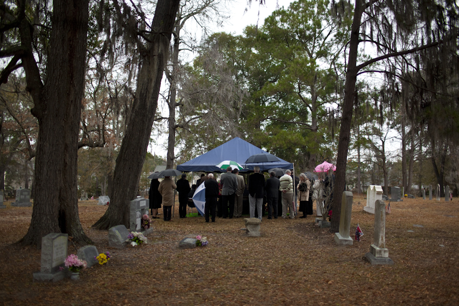 Family and friends gather and grieve while they pay their respect to Edward Frampton at the White Church Cemetey in Summerville, SC. Dec. 21, 2014