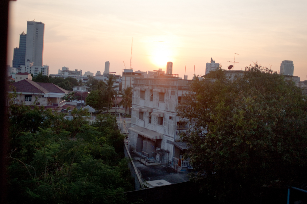A view of the city of Bangkok from a low income building that houses many different people who are seeking asylum from their country. The rooms have very little air flow which makes it extremely hot all day. Apr. 2015