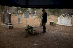 Chris prays and says her final goodbyes to her father on Sunday, Dec. 21, 2014
