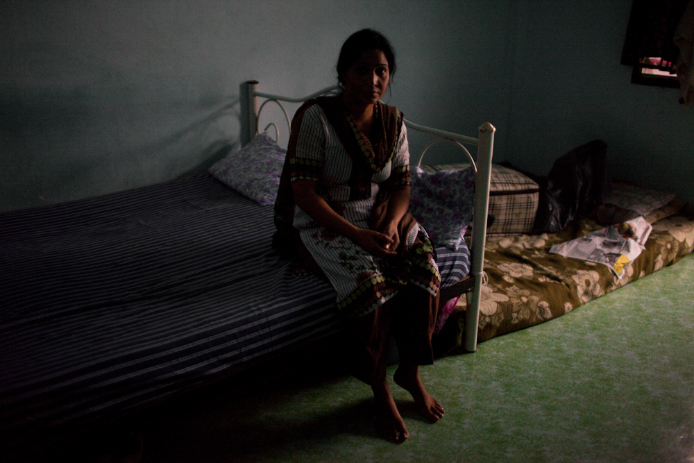 Sakeena, an asylum-seeker from Lahore, Pakistan, and mother of Asad, 22, who was arrested for having an expired visa at a nearby seven eleven store on the outskirts of Bangkok. He has been detained for 5 months inside the Immigration Detention Center. Sakeena and her husband wait patiently inside their room, hoping to receive any news regarding their son. They were recently scheduled for their visa application interview, but it was pushed ahead another six months. Mar. 2015