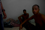 Somalian asylum-seekers in their one bedroom apartment. They have been seeking asylum in Bangkok for almost 2 years. They live together not far from one of the main buildings. They can't work due to their expired visas, so food and medical assistance is often very difficult to find. Many Somalian people who are seeking asylum in Bangkok, have been forced to leave their homeland because their tribe was often targeted as the minority and their lives were threatened. Many of them have lost all of their family members due to the on-going violence. Apr. 2015 