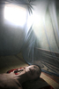 Suffering from a distorted reality, Nguyen Tran 11, gazes out from his bed at home in the Phuong Son district, Nha Trang, Vietnam.