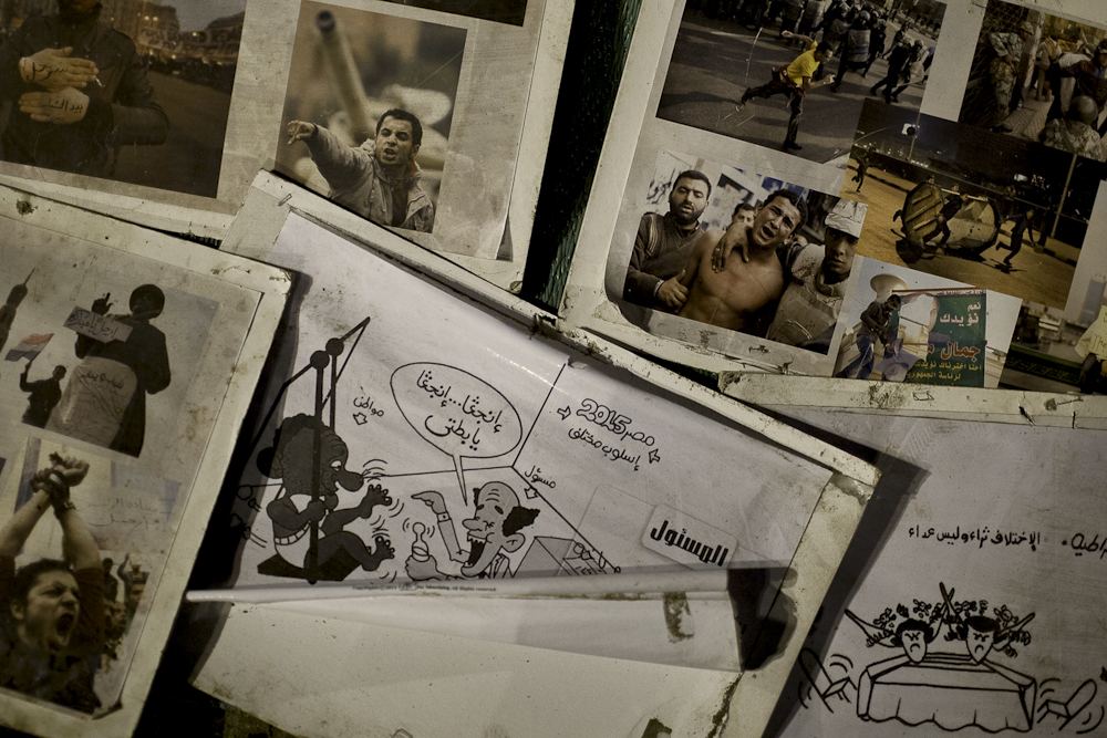 Images and posters of the early days of the revolution remain near the center of Tahrir Square. Mar. 9, 2012