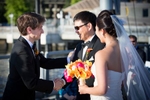 The father-of-the-bride shakes hands with the groom after he escorted the bride down the aisle during the wedding ceremony at the Seattle Aquarium. (Wedding Photography by Scott Eklund - Red Box Pictures)