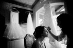 With her wedding dress hanging nearby, Silvia has her makeup applied at her Bothell, WA home in preparation for her wedding. (Photo by Scott Eklund/Red Box Pictures)