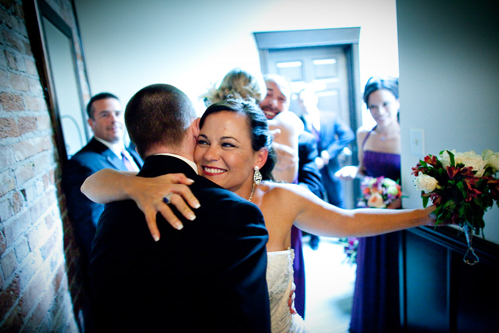 Michelle hugs a groomsman after her wedding at The Attic in Sumner, Wash.(Photography by Andy Rogers/Red Box Pictures)