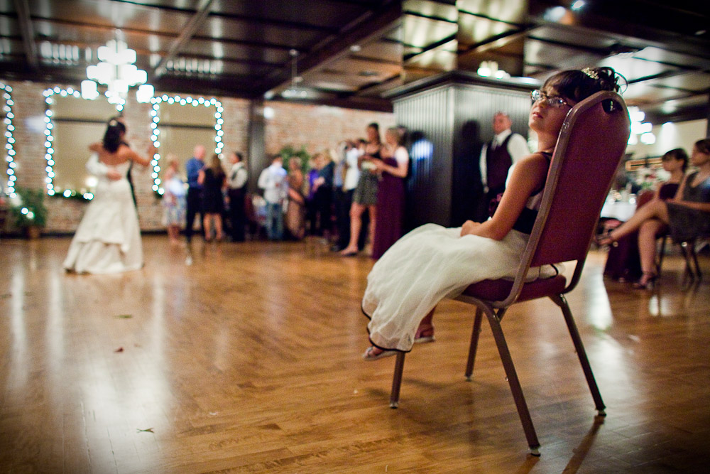 The flower girl watches as Michelle & Matt share their first dance during their reception at The Attic, in Sumner, WA. (Photo by Andy Rogers/Red Box Pictures)