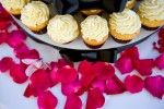 Cupcakes and rose petals at Scott and Pauline's reception at the Golf Club at Newcastle near Seattle. (Photography by Scott Eklund/Red Box Pictures)