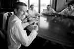 The groom Scott (left) plays poker with his groomsmen prior to his wedding at the Golf Club at Newcastle near Seattle. (Wedding Photography by Scott Eklund/Red Box Pictures)