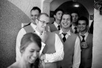 Adrian's groomsmen, including Silvia's brother, check her out as she has her wedding dress zipped up at her Bothell, WA home. (Photo by Scott Eklund/Red Box Pictures)