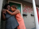 Shawn Powell, 32, right, hugs her best friend, Theresa Young, 28, in the seventh ward neighborhood of New Orleans where she found a section 8 duplex for her three daughters, two nieces and young nephew ranging from 2-years-old to 14 in March 2006. Theresa lived with her for a time. Powell had high hopes for a happy return to New Orleans from Houston but found her old neighborhood dangerous and unlivable.