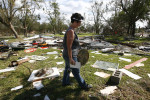 Linda McPike looks for her belongings in the remains of her home on Oak Island in Chambers County on Monday, Sept. 15, 2008.  She and her husband are not sure that they will rebuild. 