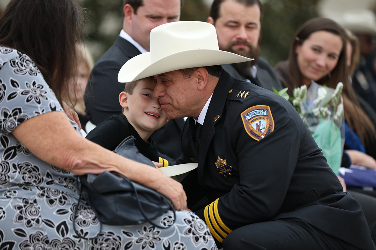 Chief Toquica hugs the son of fallen Deputy Joshua Sieman during funeral services at Parkway Fellowship in Richmond, TX on November 3, 2021. Deputy Sieman, 39, passed away on October 21 of COVID-19 complications. He joined our agency in 2016 and was assigned to Patrol District 5 in northwest Harris County, where he served as a member of the Crime Reduction Unit. 