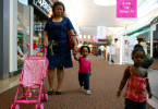 Celestina walks with the children of a friend through a mall in Sugarland, TX.