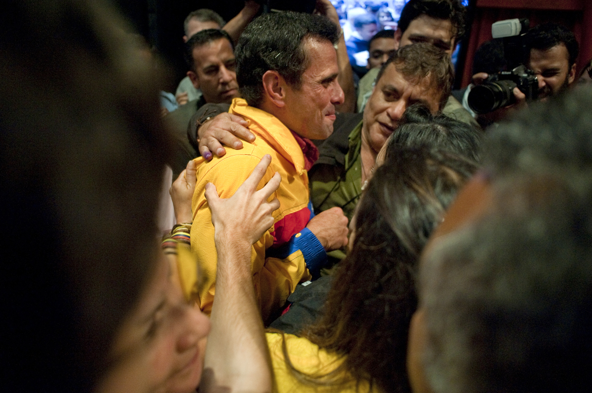 Henrique Capriles is greeted by supporters after conceding the election on Sunday night.