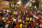 Thousands of Chavez supporters take to the streets in downtown Caracas to celebrate his re-election.