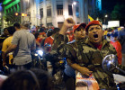 A Chavez supporter cheers from his motorcycle in downtown Caracas as he celebrates the president's re-election.