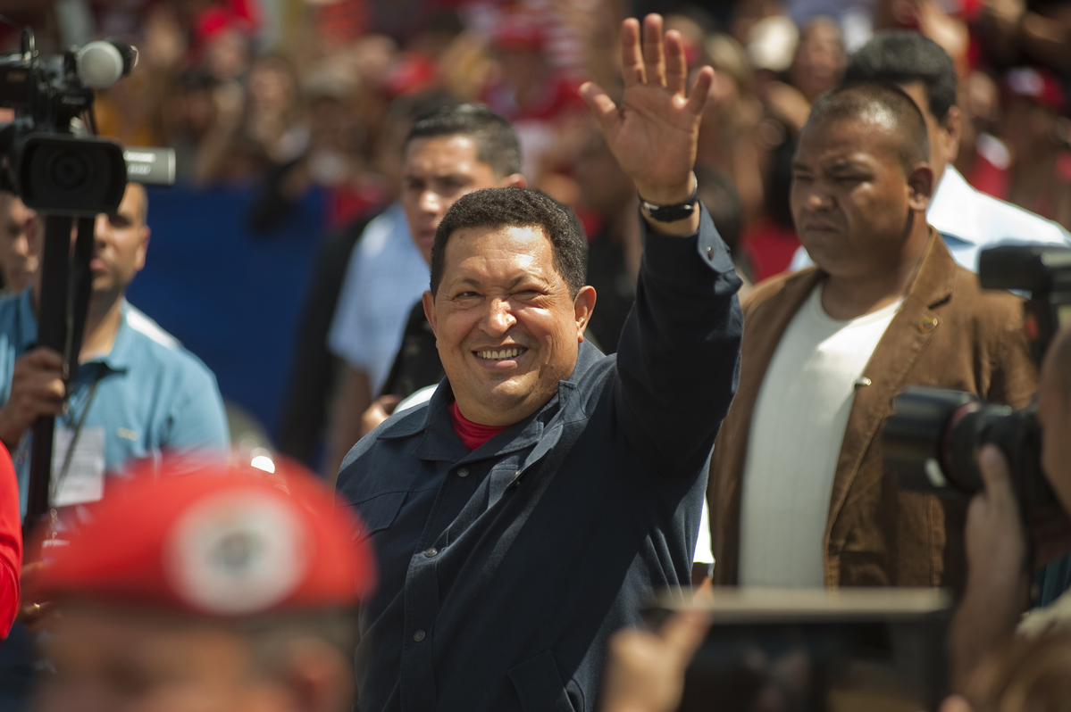 Hugo Chavez waves to fans as he arrives to vote at a voting center in the 23 de Enero neighborhood of Caracas.