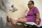  Lucia Feireira Ojamatos, 71, has her bandages changed on her infected legs at Colonia Antonio Alexio in Manaus, Brazil on Saturday, March 17, 2012. An orphan from the rural Amazon, she was brought to the leprosarium at age 14 by a woman who raised her. She never saw anyone from her home again. 