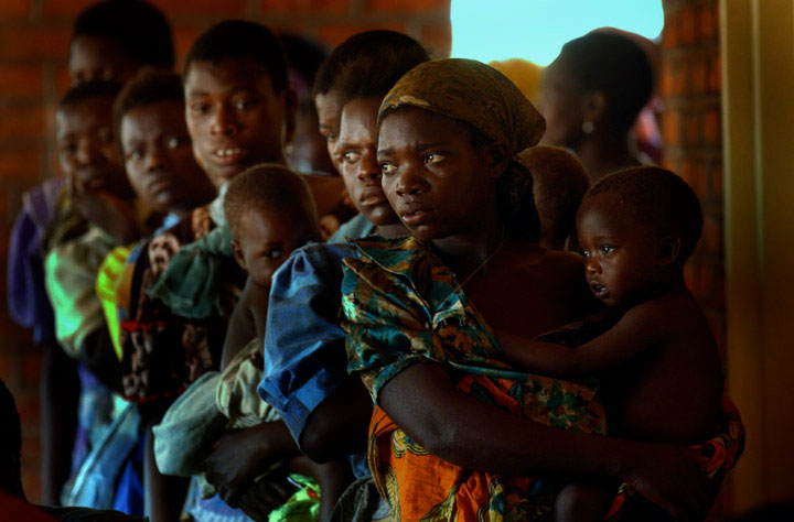 Mothers wait to have the children checked by doctors at a clinic in Malawi.