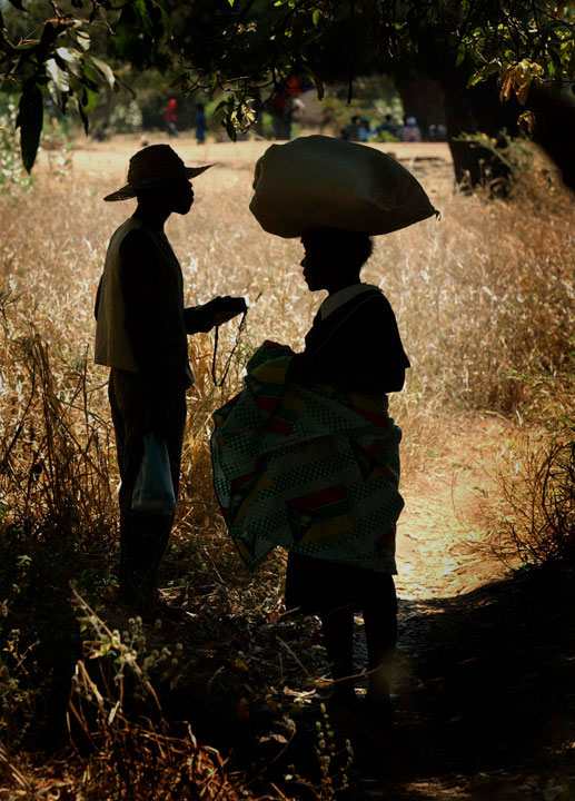 Villagers pause to talk after a World Food Program distribution in Malawi. 