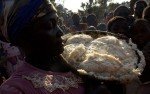 A steaming pile of nsima (cornmeal) is brought to a table during a wedding ceremony. Food insecurity in southern Africa is a perennial problem but food aid often helps alleviate the worst effects.