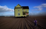 It was no ordinary house move when a Junction City, Oregon family decided to relocate an old farmhouse to their new property. Movers decided it would be easier to travel across fallow grass seed fields. This created an interesting visual effect but the semi-truck pulling the house on the other side was testament it was definitely not floating.