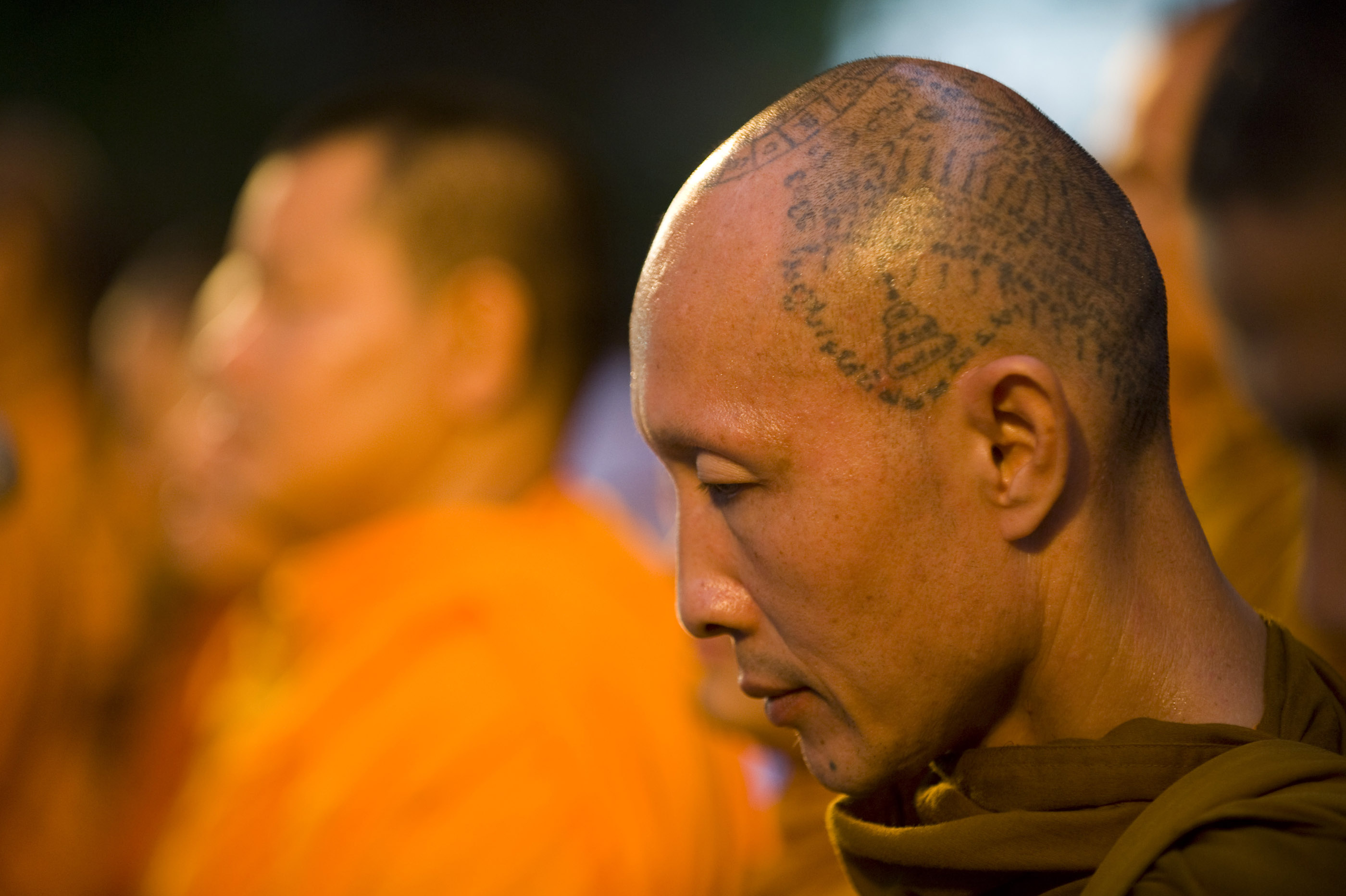 Monks pray while visiting the protest site.