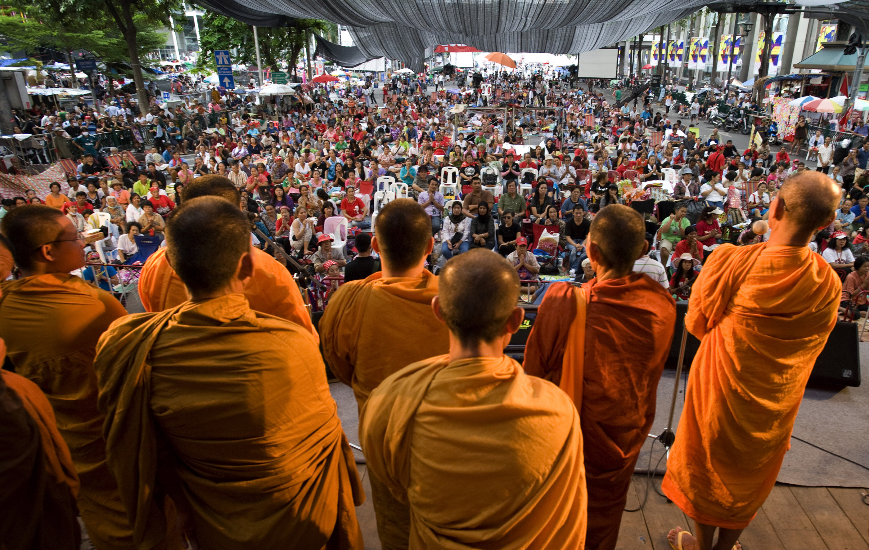 Buddhist monks pray with Red Shirt protesters at their main stage area in the heart of Bangkok.