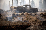 September 15, 2020: The ground still smokes in Blue River, Ore., Sept. 15, 2020 eight days after the Holiday Farm Fire swept through its business district. More than 300 structures have been confirmed destroyed in the fire. Mandatory Credit: Pool photo/Andy Nelson/The Register-Guard via USA TODAY NETWORK